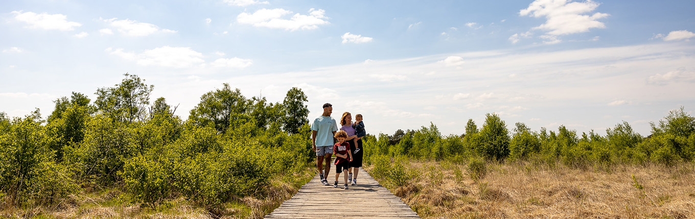 Family walking in De Groote Peel National Park