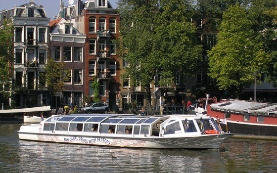 A canal bus and some houses