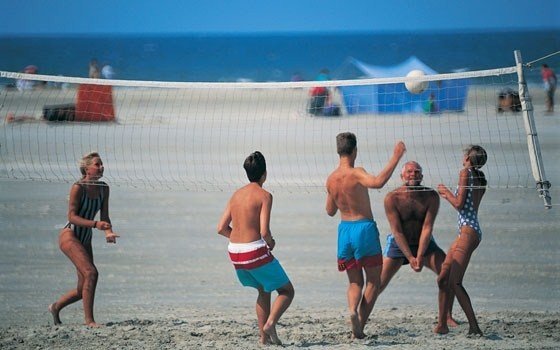 People playing beach volleyball in terschelling