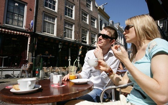 Relaxing people on a terrace in Utrecht