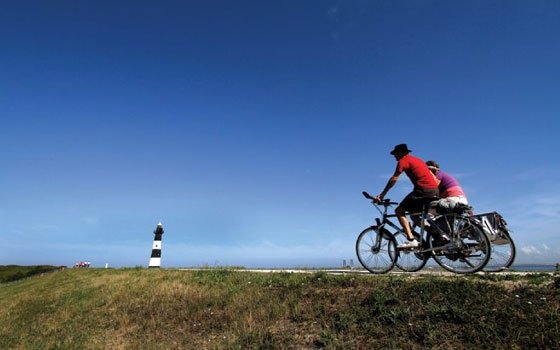 Bicycling in Holland is the best way to see the countryside and get some exercise, too -- but without hills to climb. Photo from Netherlands Board of Tourism. 