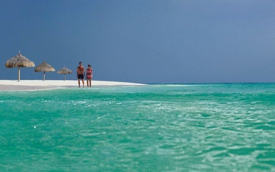Couple standing on a beach of Aruba