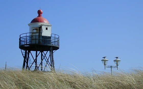 a small tower on the beach near Kijkduin