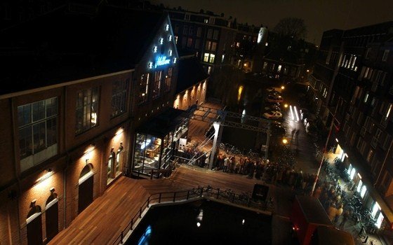 A line in front of the Melkweg music venue at night