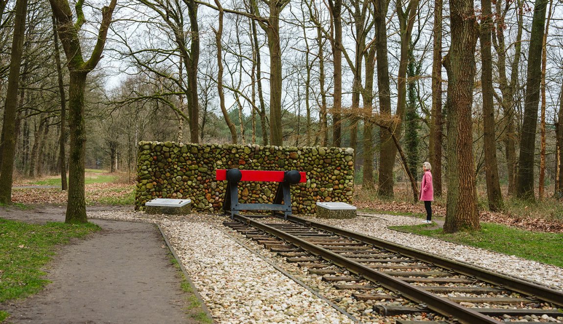Camp Westerbork Assen lady looks at tram rails, terminus