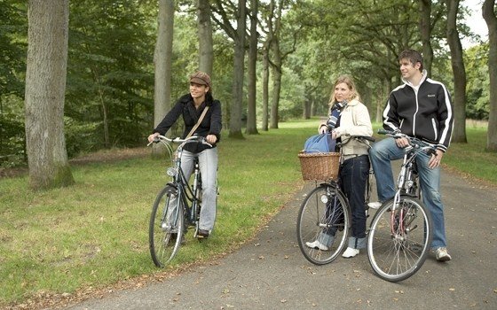 2 girls and 1 boy cycling