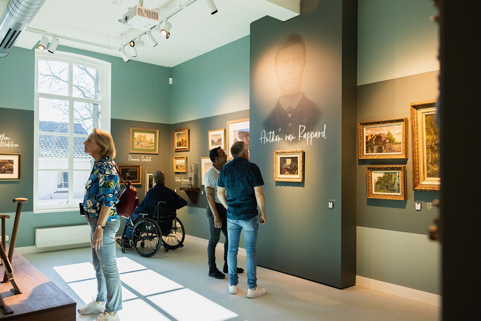 Van Gogh Village Museum visitors view paintings