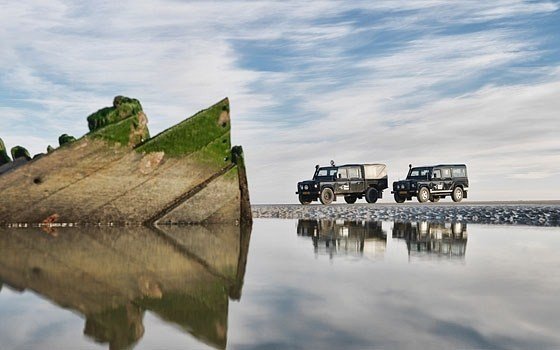 Cars next to water