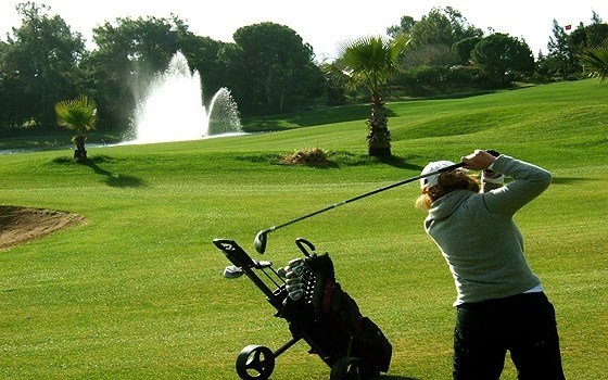 A woman golfing