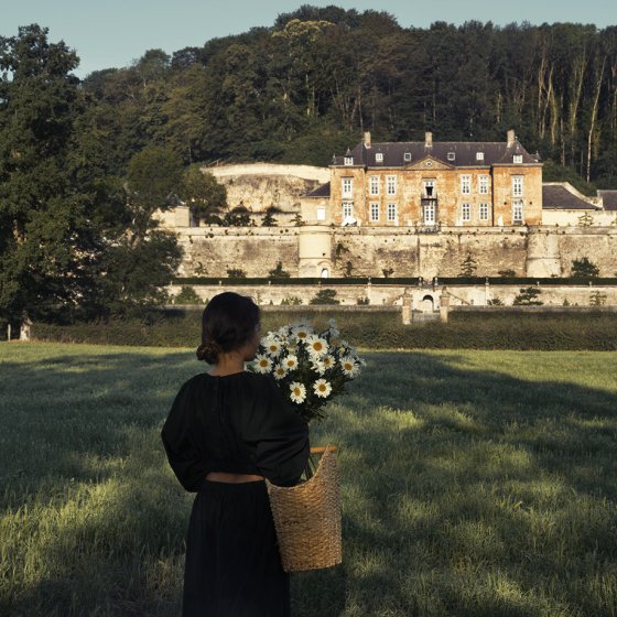Chateau Neercanne: a basket of flowers in a field