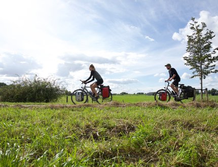 Couple on cycling vacation through the Netherlands