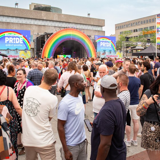 People gather in front of the rainbow stage during Crowds gather in front of the rainbow stage during Eindhoven Pride Vibes Festival celebrations