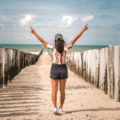 Woman walking beach Domburg Zeeland