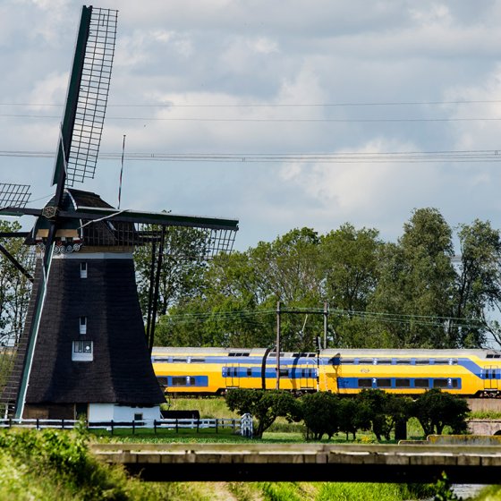NS train through landscape with mill
