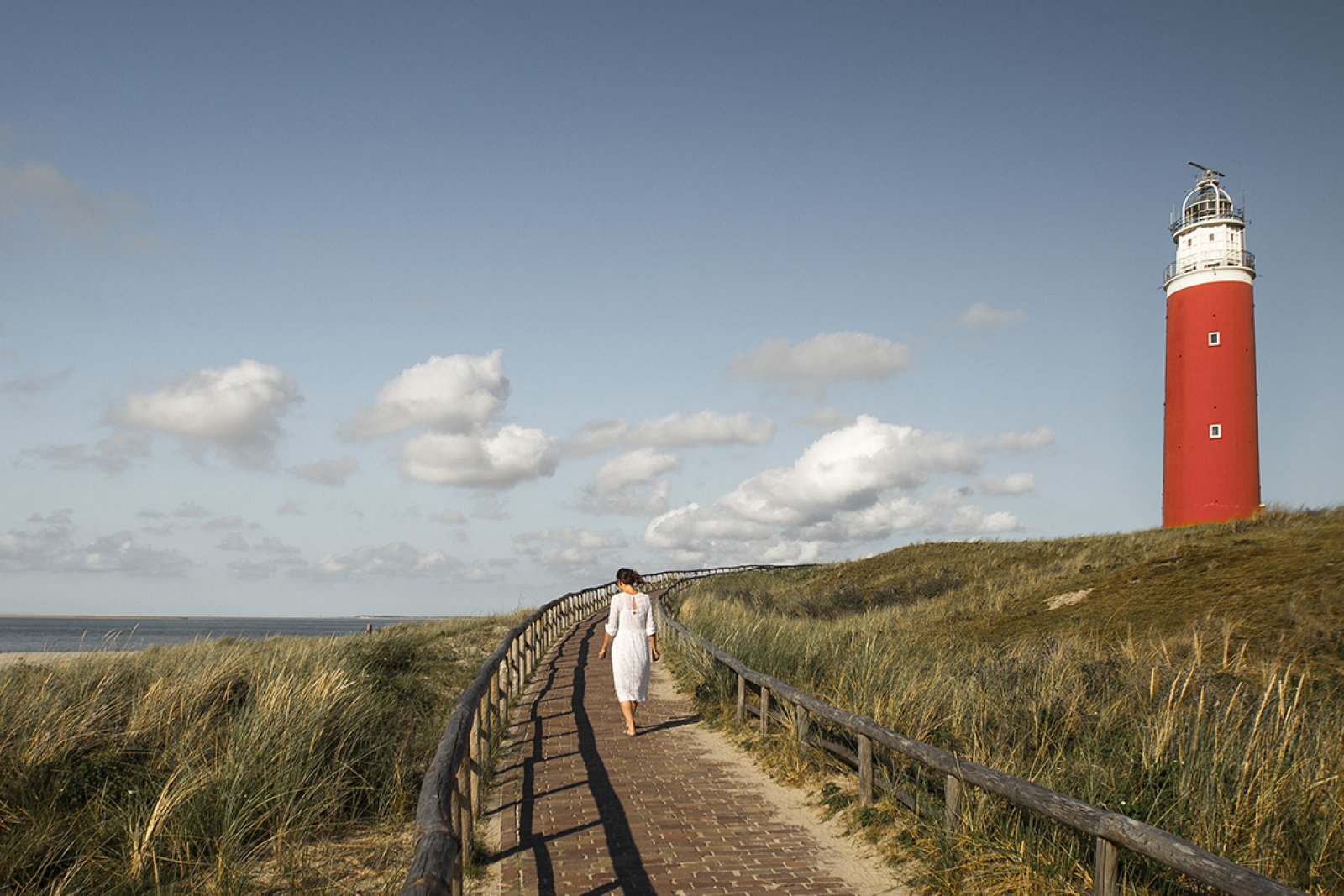 Woman at the Texel lighthouse in summer