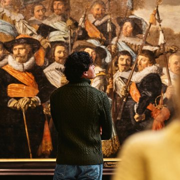 Visitor exploring Dutch Golden Age paintings at the Frans Hals Museum in Haarlem, one of the Netherlands&rsquo; leading museums for Dutch Masters