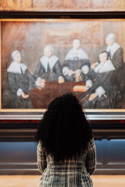 Lady views painting in Frans Hals Museum Haarlem