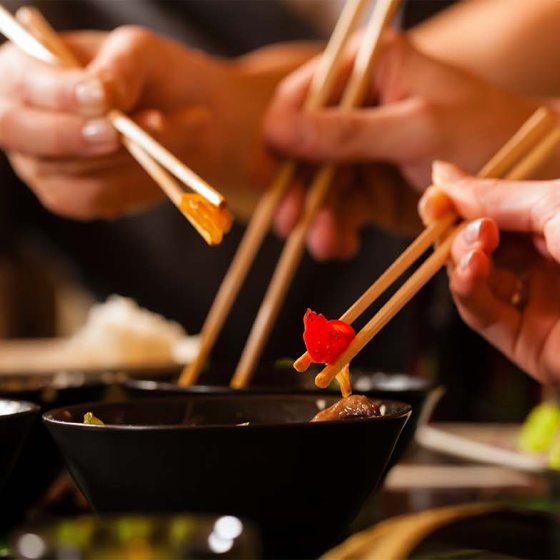 Young people eating in a Thai restaurant