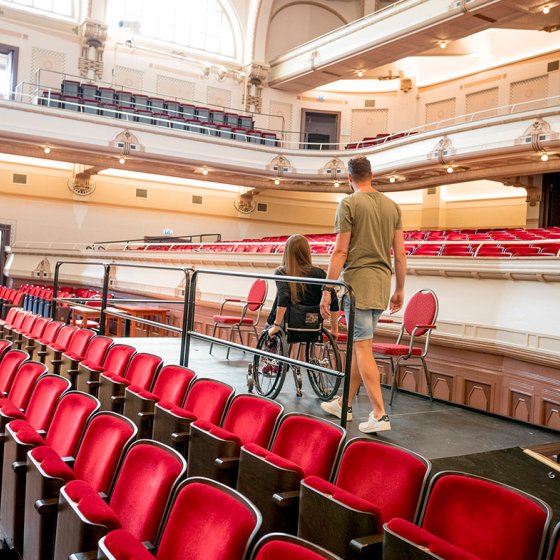 Couple visits Concertgebouw de Vereeniging Nijmegen. Lady is in a wheelchair.