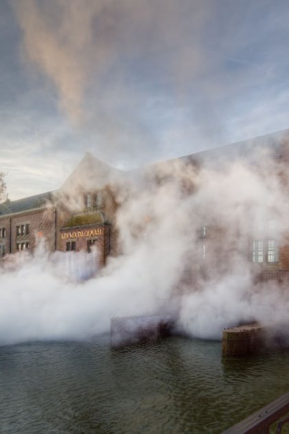 Woudagemaal pumping station with steam coming out of the building