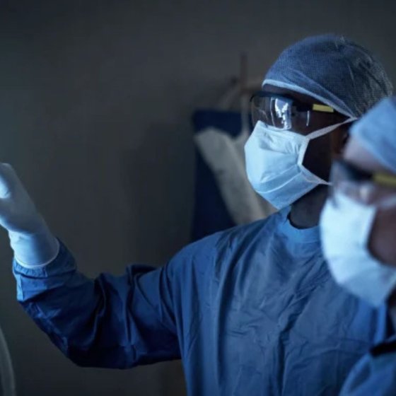 Medical professionals examining a lung scan using AI-supported imaging technology from Dutch company Thirona