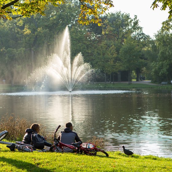Amsterdam Vondelpark people sitting on waterfront