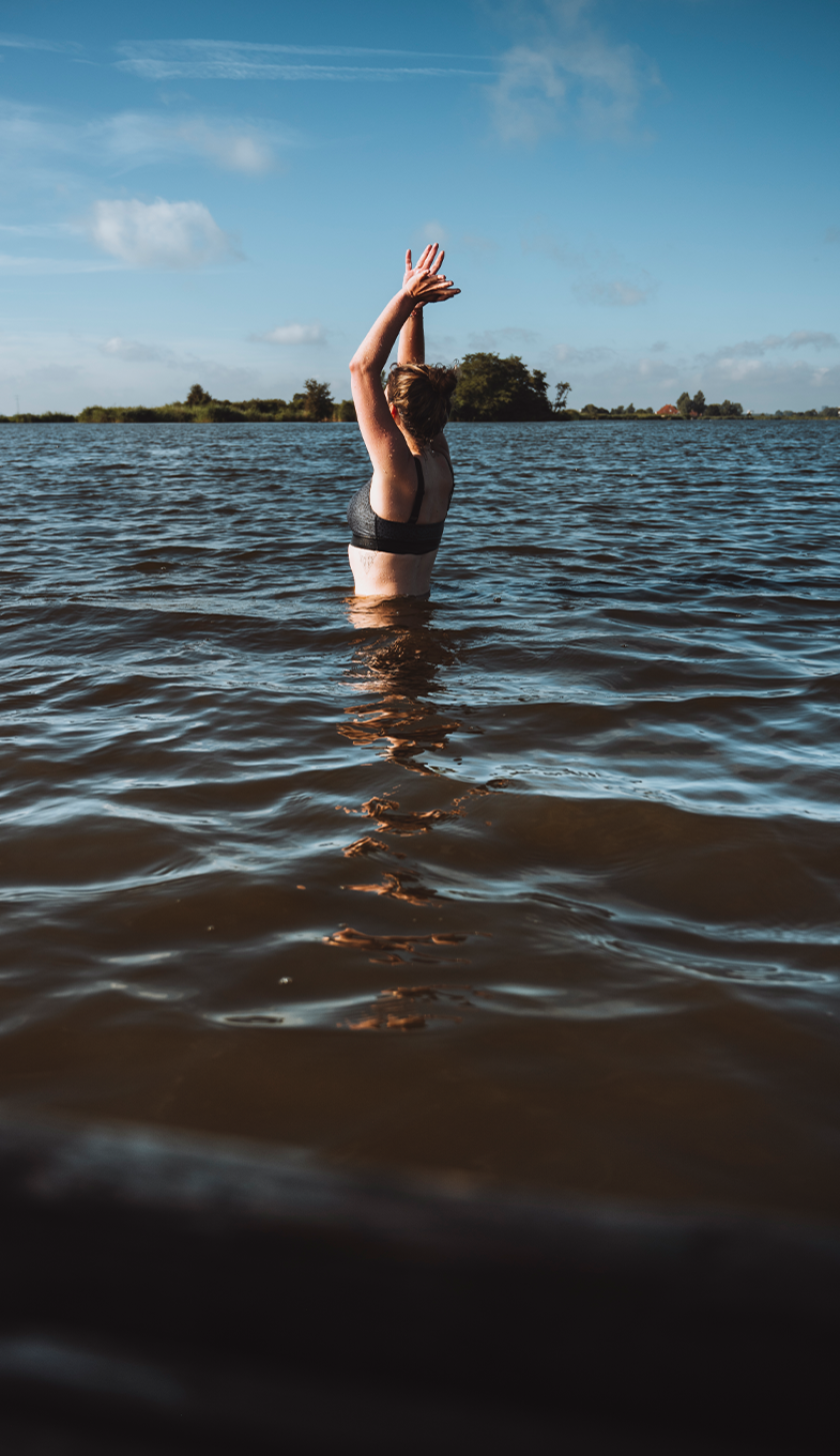 Girl swimming in a lake 