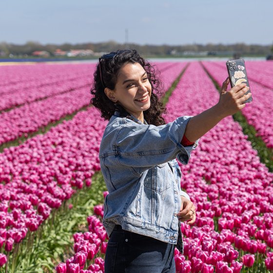Selfie besides the tulips