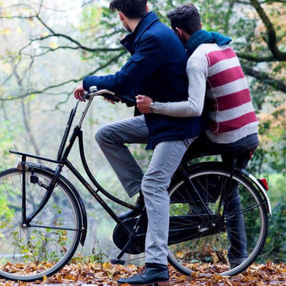 Two boys on bikes in the woods, fall