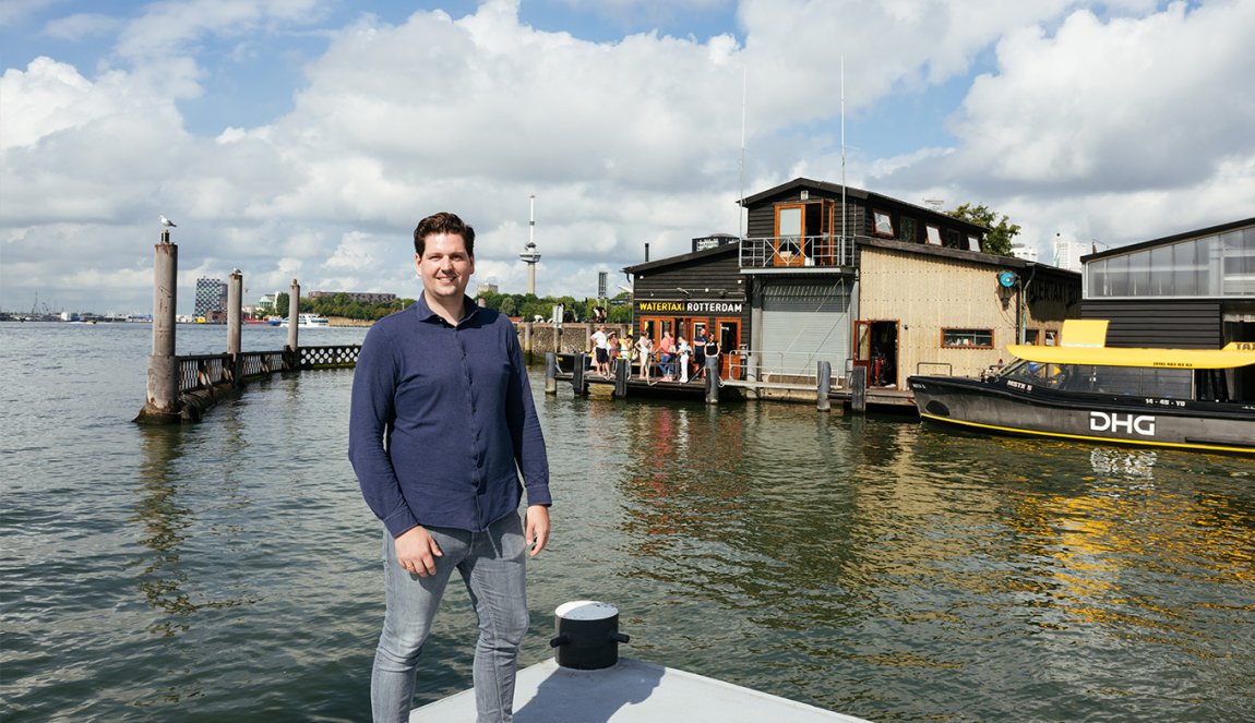 Portrait Erick van de Scheur Watertaxi Rotterdam on the quay with office backdrop