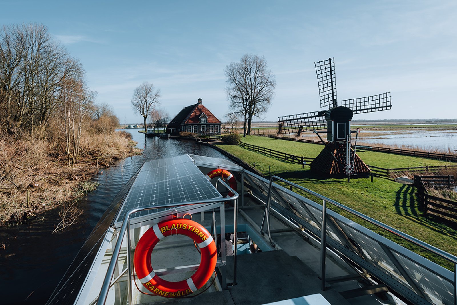 Winter in Friesland, Alde Faenen. View from boat on mill