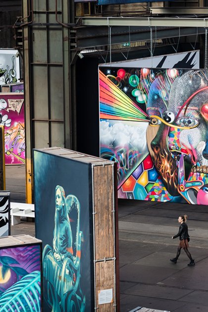 Woman walks through the STRAAT Museum at the NDSM site in Amsterdam
