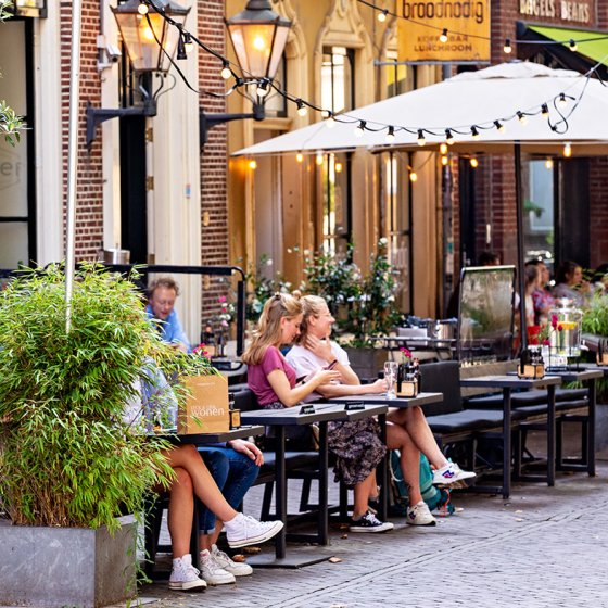People on terraces at Mariaplaats in Utrecht