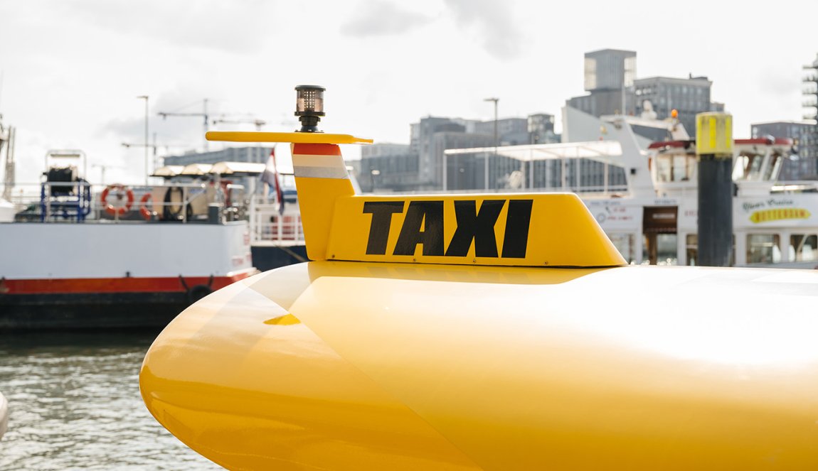Portrait Erick van de Scheur Watertaxi Rotterdam yellow taxi sign