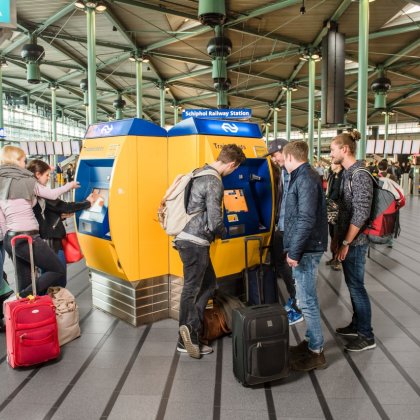 Schiphol Plaza, visitors buy ticket for public transport