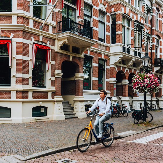 Utrecht Maliebaan cyclist with old facade buildings
