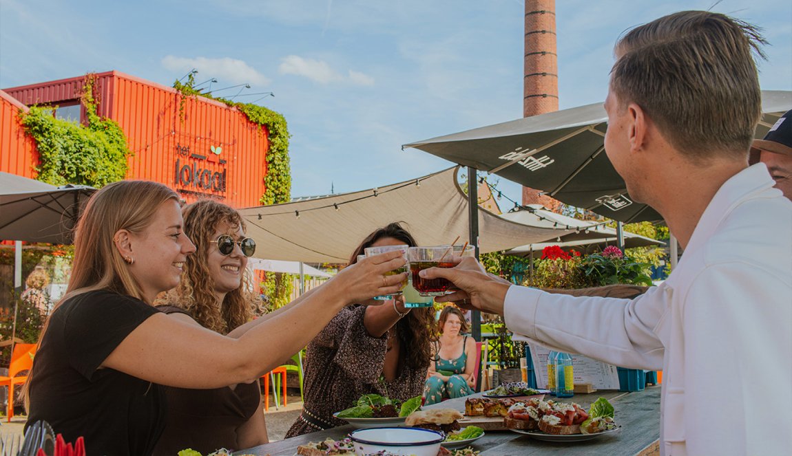 Visitors toast on terrace of Het Lokaal Amersfoort