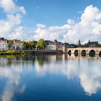 Historic Maastricht and Sint Servaas Bridge along the Meuse River, home to Maastricht Convention Bureau