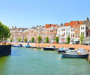 View of Middelburg with beautiful houses and boats along the canal.