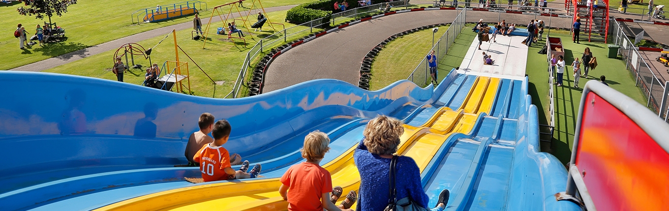 Sliding down the coloured slide Sliding down the coloured slide