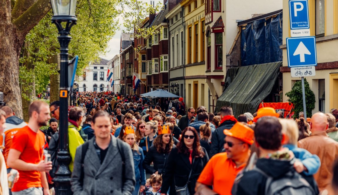 Crowd in orange celebrating Kingsday in Utrecht