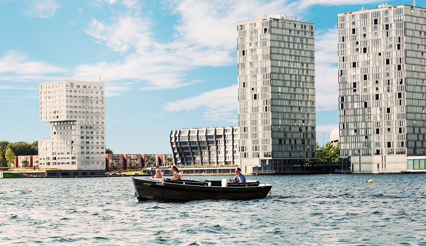 Boating in Almere surrounded by architectural gems