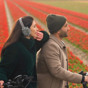 People on a bike near the flower fields