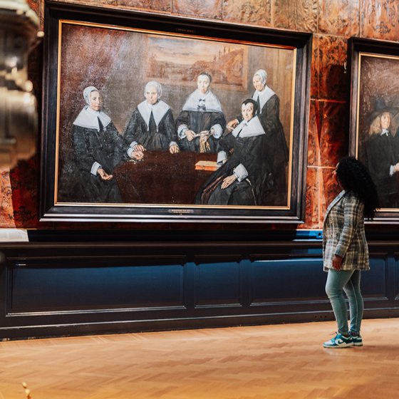 Lady looks at paintings in Haarlem Frans Hals Museum 