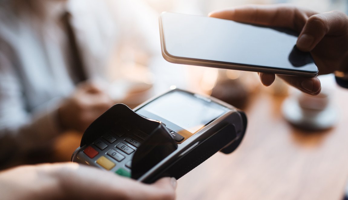 Paying with cell phone © Pressmaster via Shutterstock