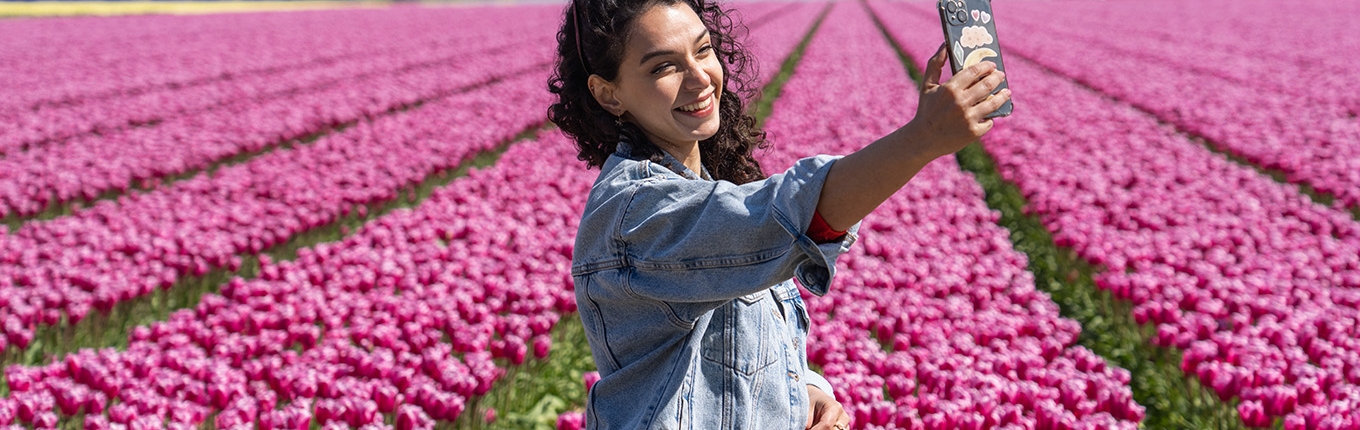 Selfie besides the tulips