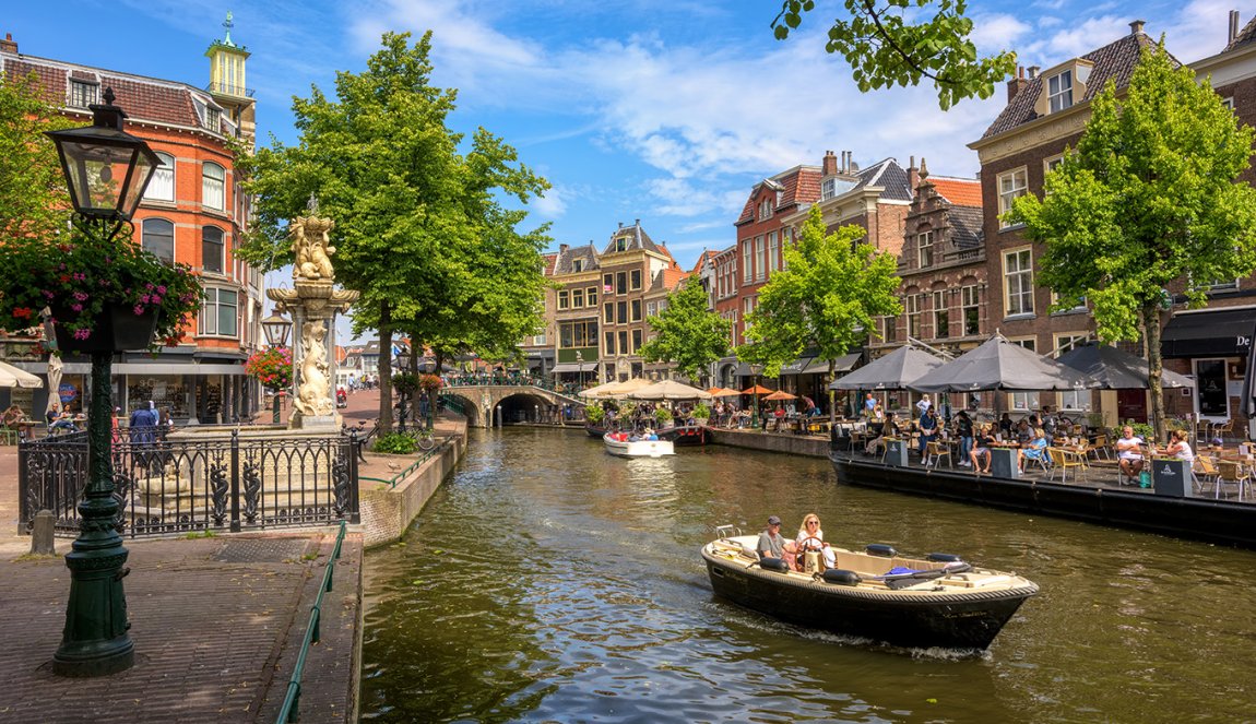 Boating on the canals in historical Leiden city center Boating on the canals in historical Leiden city center