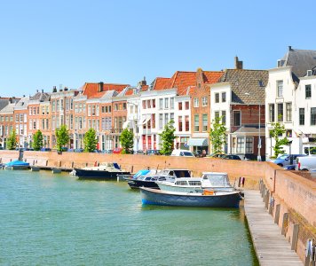 View of Middelburg with beautiful houses and boats along the canal.