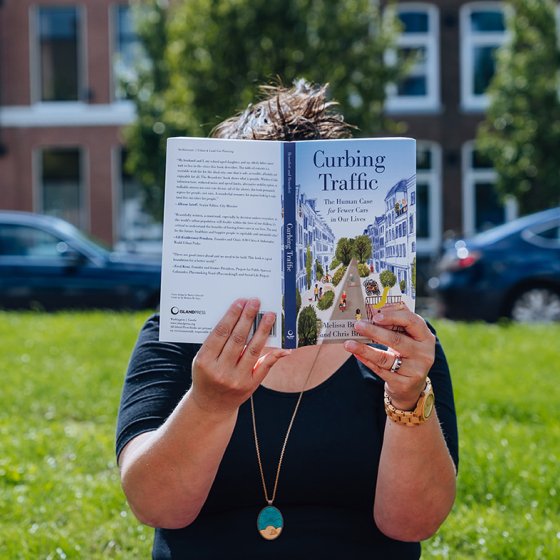 Melissa Bruntlett with her book Curbing Traffic