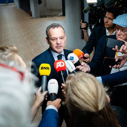International media interviewing a delegate during a major event in the Netherlands
